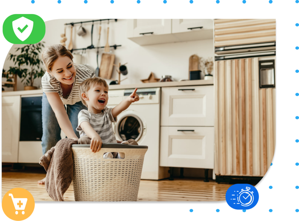 woman playing with her son smiling and pushing him in laundry basket laundry ideas wash and fold laundry service